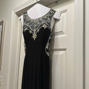 Black elegant gown with crystal embellishment.